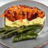 Char grilled Peri spiced chicken breast served with creamy mash and steamed greens