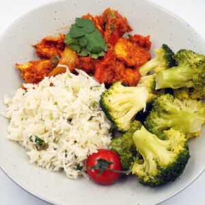 Chicken jalfrezi served with cauliflower rice and steamed broccoli
