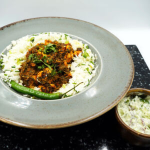 Chicken spinach curry served with steamed cauliflower rice and steamed greens