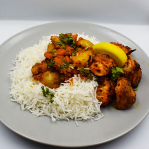 Chicken tikka with vegetable curry and steamed basmati rice