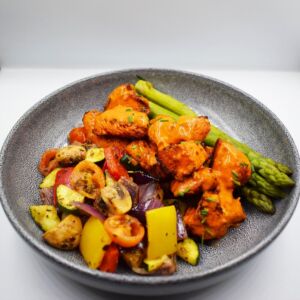 Peri chicken bites served with med veg and steamed asparagus.