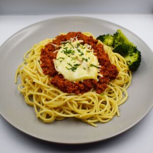 Lamb Bolognese with spaghetti, steamed broccoli, topped with mozzarella cheese.