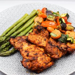 med style chicken thighs served pesto veg and steamed asparagus.