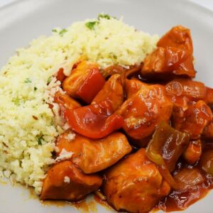 Sweet and sour chicken served with cauliflower rice.